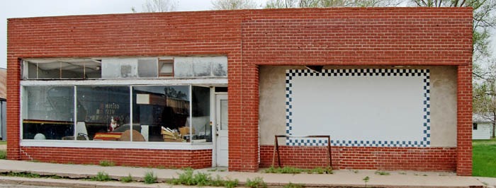 Old business building in Burdett, Kansas by Kathy Weiser-Alexander.