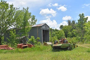 Old shed and equipment in Bala, Kansas by Kathy Alexander.