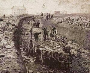 Hand digging the railroad cut at Melvern Kansas, 1882.