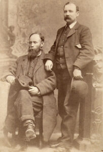 John W. McDanield, seated, and his son standing.