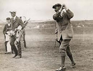 Junius G. Groves playing golf on his golf course