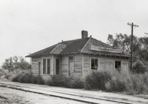 Salina Northern Railroad and Atchison, Topeka and Santa Fe Railway Company Depot in Ash Grove, Kansas, about 1950.