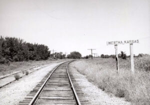 Missouri, Kansas, & Texas Railroad sign board in Hertha, Kansas by H. Killam, 1962.