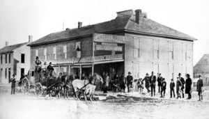 A stagecoach at the Central Hotel in Winfield, Kansas, 1877.