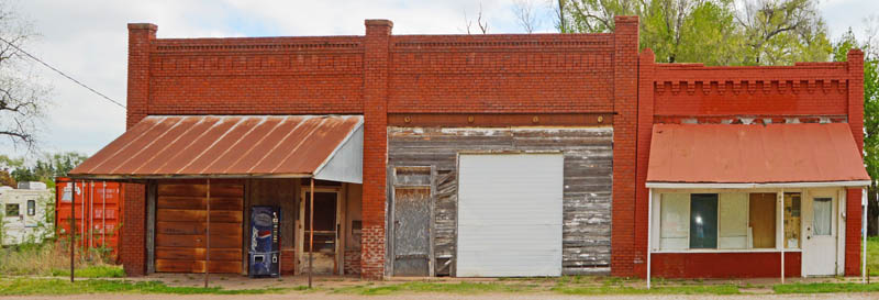 Business building row in Milan, Kansas by Kathy Alexander.
