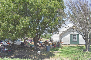 Junky house in Perth, Kansas by Kathy Alexander.