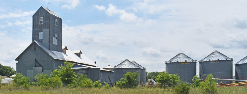 Silos and grain elevator in Ames, Kansas by Kathy Alexander.