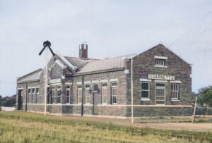 Atchison, Topeka & Santa Fe Depot in Garnett, Kansas by H. Killam, 1966.