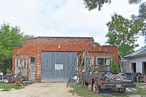 Old auto service garage in Ionia, Kansas by Kathy Alexander.