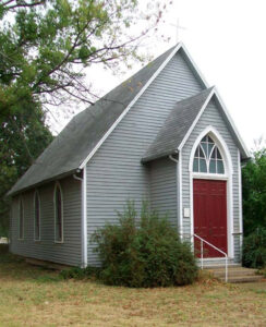 The old Runnymede Church in Harper, Kansas now serves as a museum.