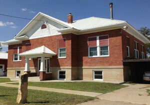 The old brick school in Calvert, Kansas now serves as a residence.