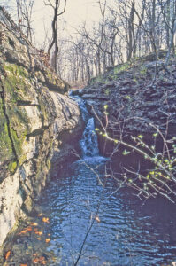 Waterfall over Mississippian-age limestone in Cherokee County, Kansas courtesy of Kansas Geological Survey.