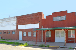 Business buildings in Preston, Kansas by Kathy Alexander.