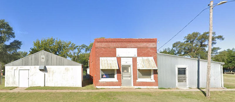 Old buildings on Main Street in Wells, Kansas, courtesy Google Maps.