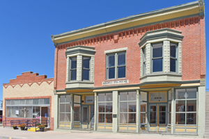 Post Office and Opera House in Atwood, Kansas. The two-story red brick Shirley Opera House, at right, was constructed in 1907. The Late Victorian-era commercial building was listed on the National Register of Historic Places on January 16, 2007. Post Office and Opera House in Atwood, Kansas.The two-story red brick Shirley Opera House, at right, was constructed in 1907. The Late Victorian-era commercial building was listed on the National Register of Historic Places on January 16, 2007.