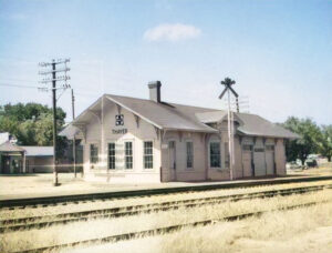 Atchison, Topeka & Santa Fe Railroad Depot in Thayer, Kansas by H. Killam, 1959.