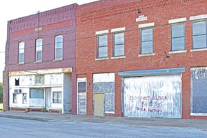 Old business buildings in Buffalo, Kansas by Kathy Alexander.