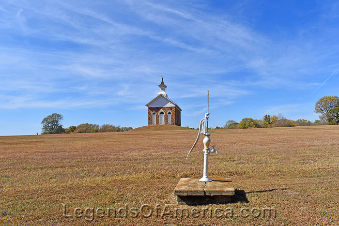 Old school and pump in Arvonia, Kansas, by Kathy Alexander.