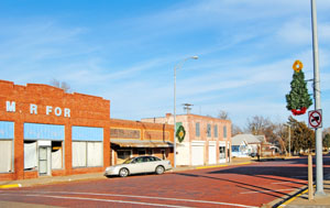 Business buildings in Kinsley, Kansas by Kathy Alexander.