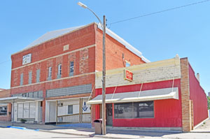 Business buildings in Sharon Springs, Kansas by Kathy Alexander.